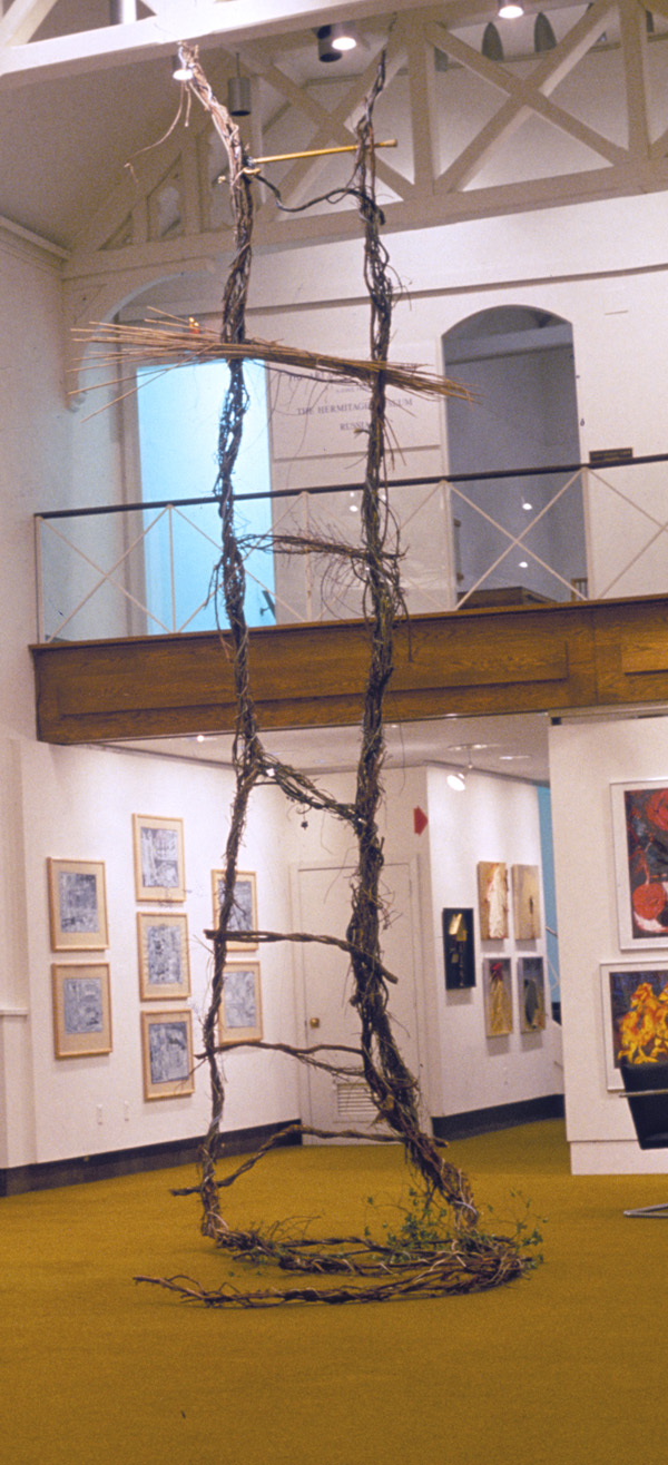 The Word Ladder In An Other Language
wild kudzu vine, electrical wire, walking cane, reeds

H. 30′ W. 3.5′

NFS