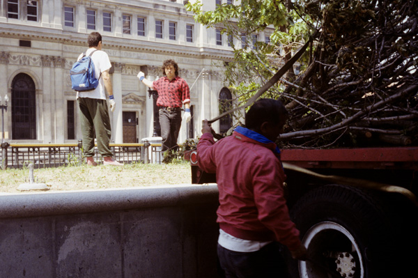 The River Within/El Rio Desde Adentro: Medellin, Colombia environmental artists unloading truck at the installation site on the Providence River; left to right, Juan Luis Mesa, Carlos Uribe

trimmed branches