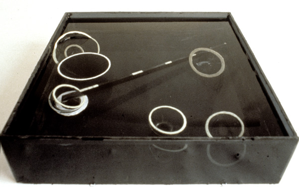 Lassitude of the Finite I

black glass, water, phosphorescent paint

H. 7″ W. 17″ D. 17″